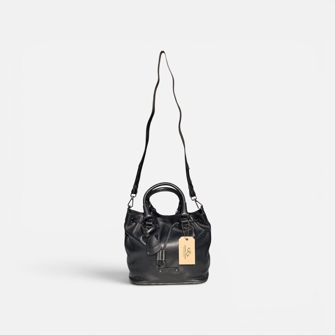 Chris Louis black full grain leather satchel bag with top handle, drawstring closure, and adjustable crossbody strap.