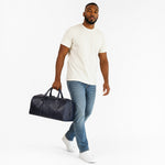 Chris Louis black genuine leather travel overnight bag with top handles and detachable shoulder strap.