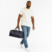 Chris Louis black genuine leather travel overnight bag with top handles and detachable shoulder strap.