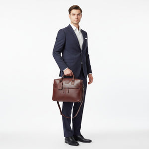 Chris Louis brown genuine leather briefcase with zippered front pockets and top handles, worn by a woman in an office setting.
