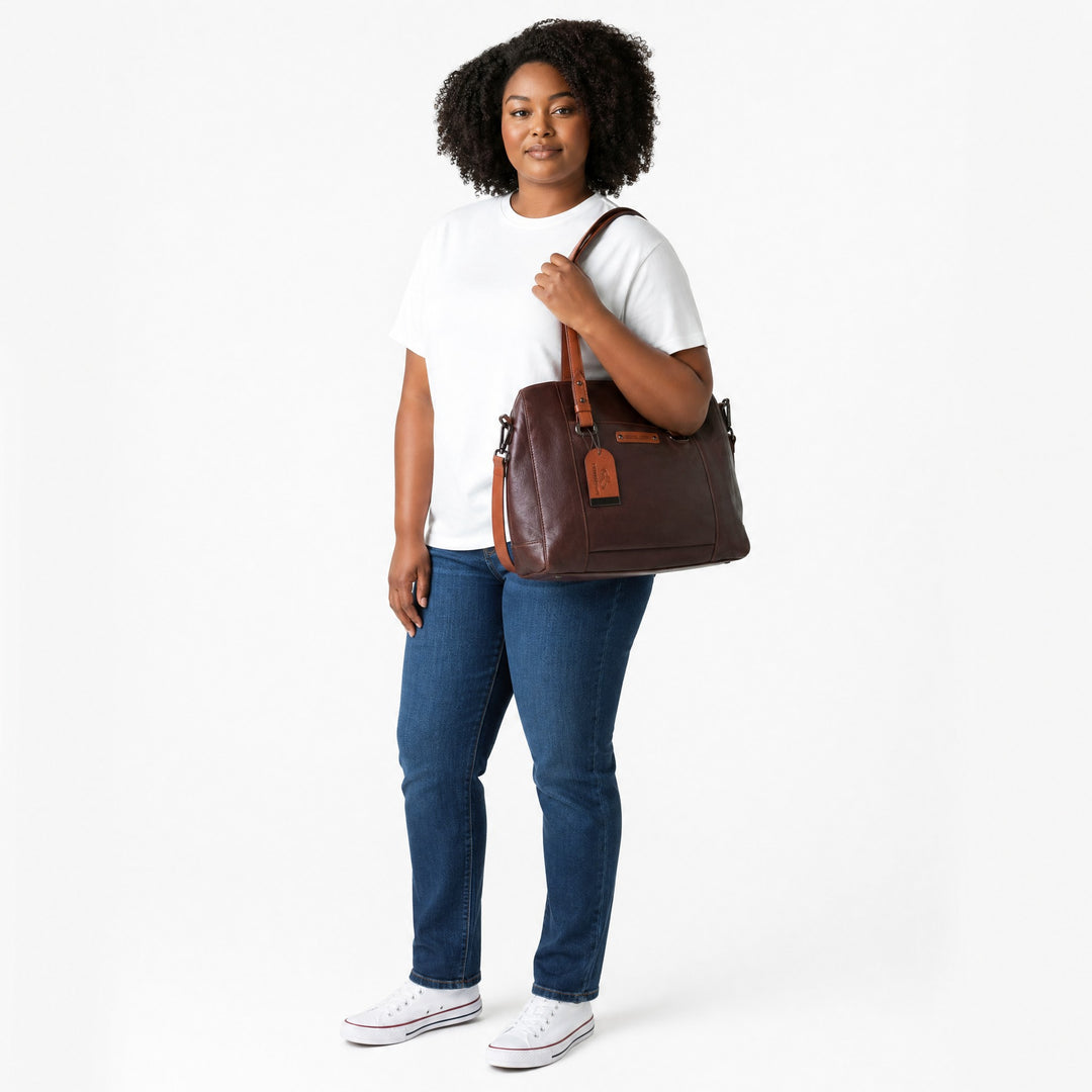 Chris Louis large brown leather satchel bag with tan accents and adjustable shoulder strap.