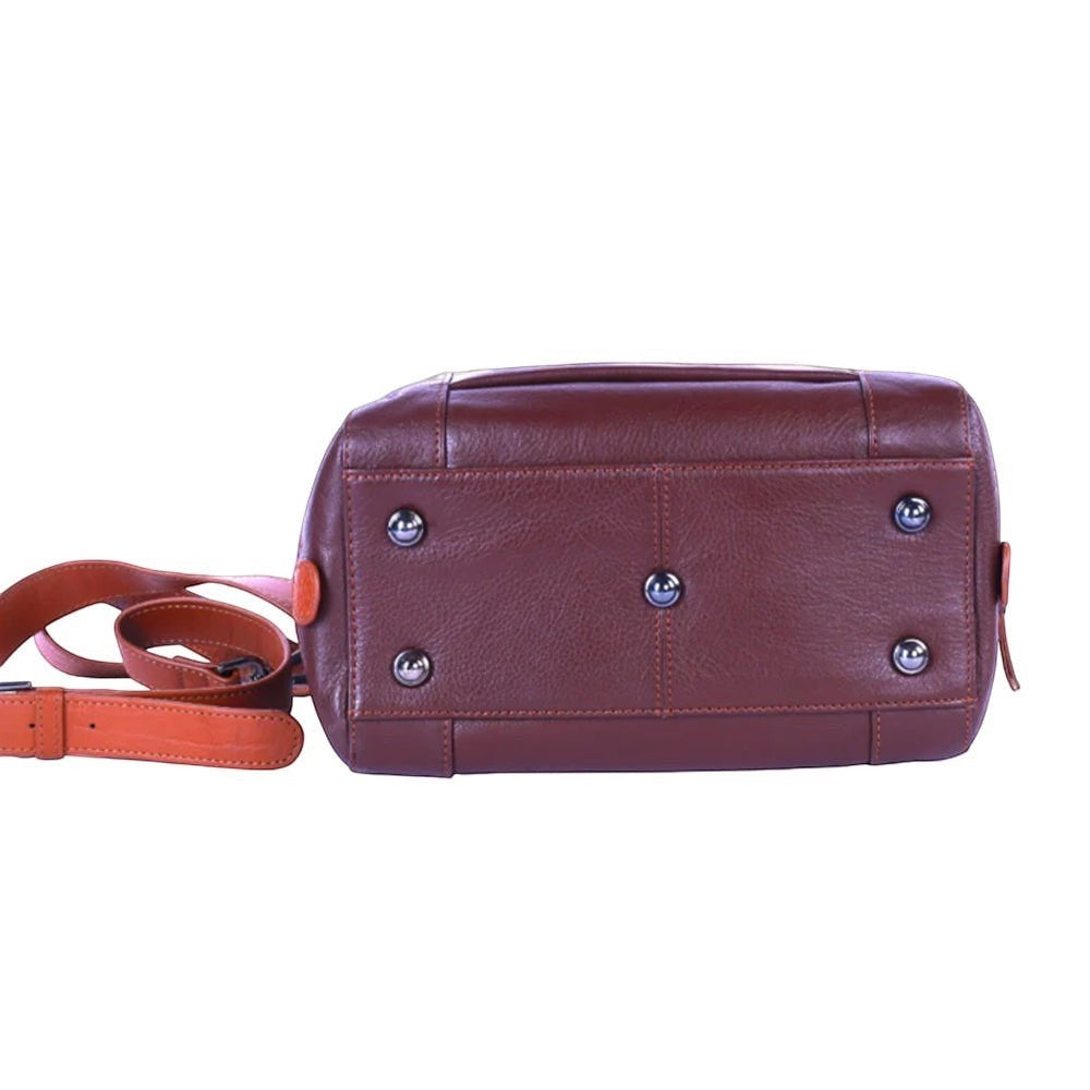 Chris Louis brown leather satchel handbag with orange accents and metal feet.
