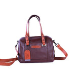 Chris Louis brown leather satchel handbag with orange accents on handles and strap. Features a spacious compartment and adjustable strap.
