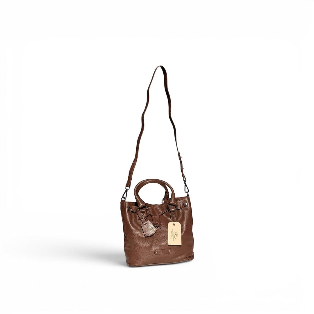 Chris Louis brown full grain leather satchel bag with top handle, drawstring closure, and adjustable crossbody strap.
