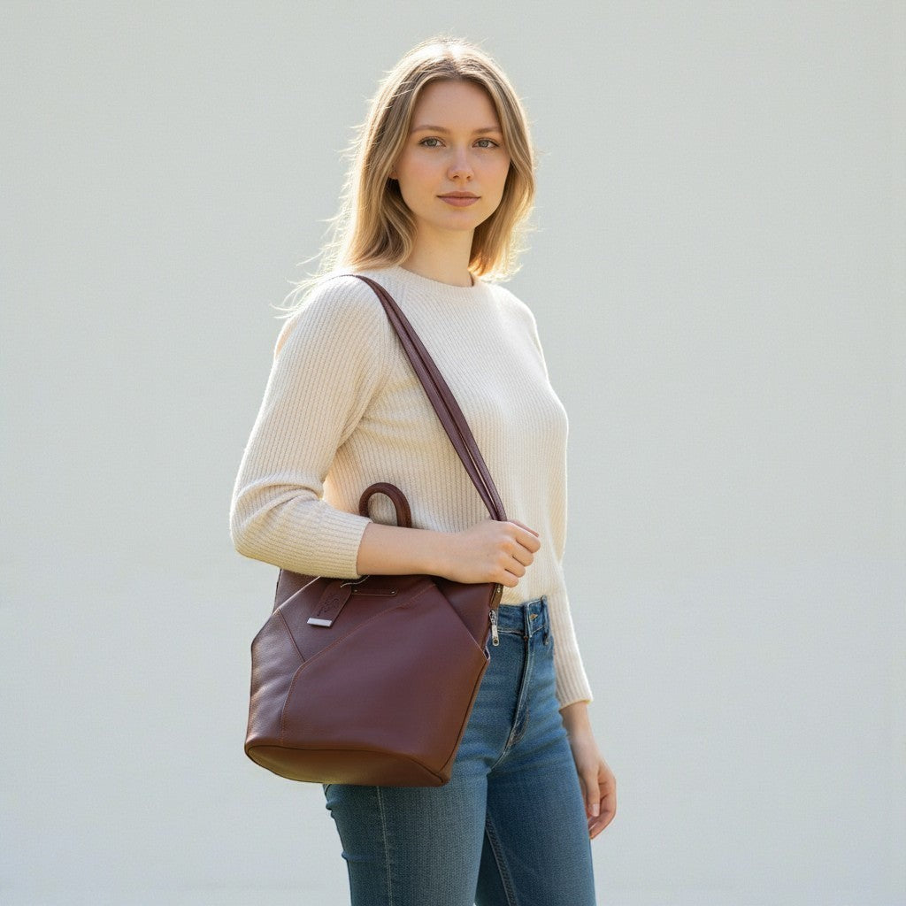 Chris Louis brown genuine leather hexagon shoulder bag with adjustable straps and front zipper pocket.