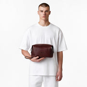 Chris Louis brown genuine leather toiletry bag with multiple compartments and zipper closure.