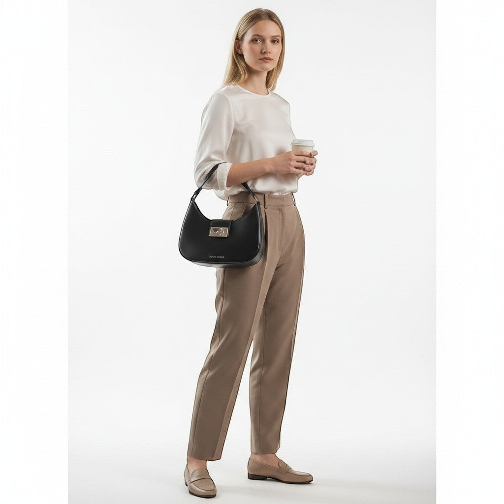Chris Louis Fiona black faux leather shoulder bag with silver-tone hardware and curved silhouette.