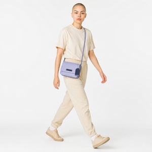 Chris Louis Isfahan Crossbody Sling Bag in light grey leather with navy blue accents and detachable strap.
