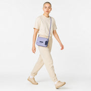 Chris Louis Isfahan Crossbody Sling Bag in light grey leather with navy blue accents and detachable strap.