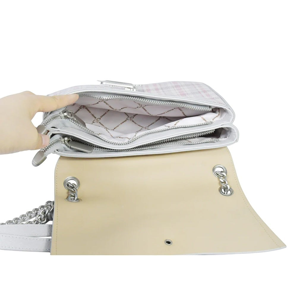 Chris Louis Ketty crossbody bag in light grey with pink plaid pattern, silver chain strap, and dual zip compartments.