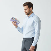Chris Louis genuine leather bifold wallet in lavender, with card slots and bill compartment. Man holding wallet.