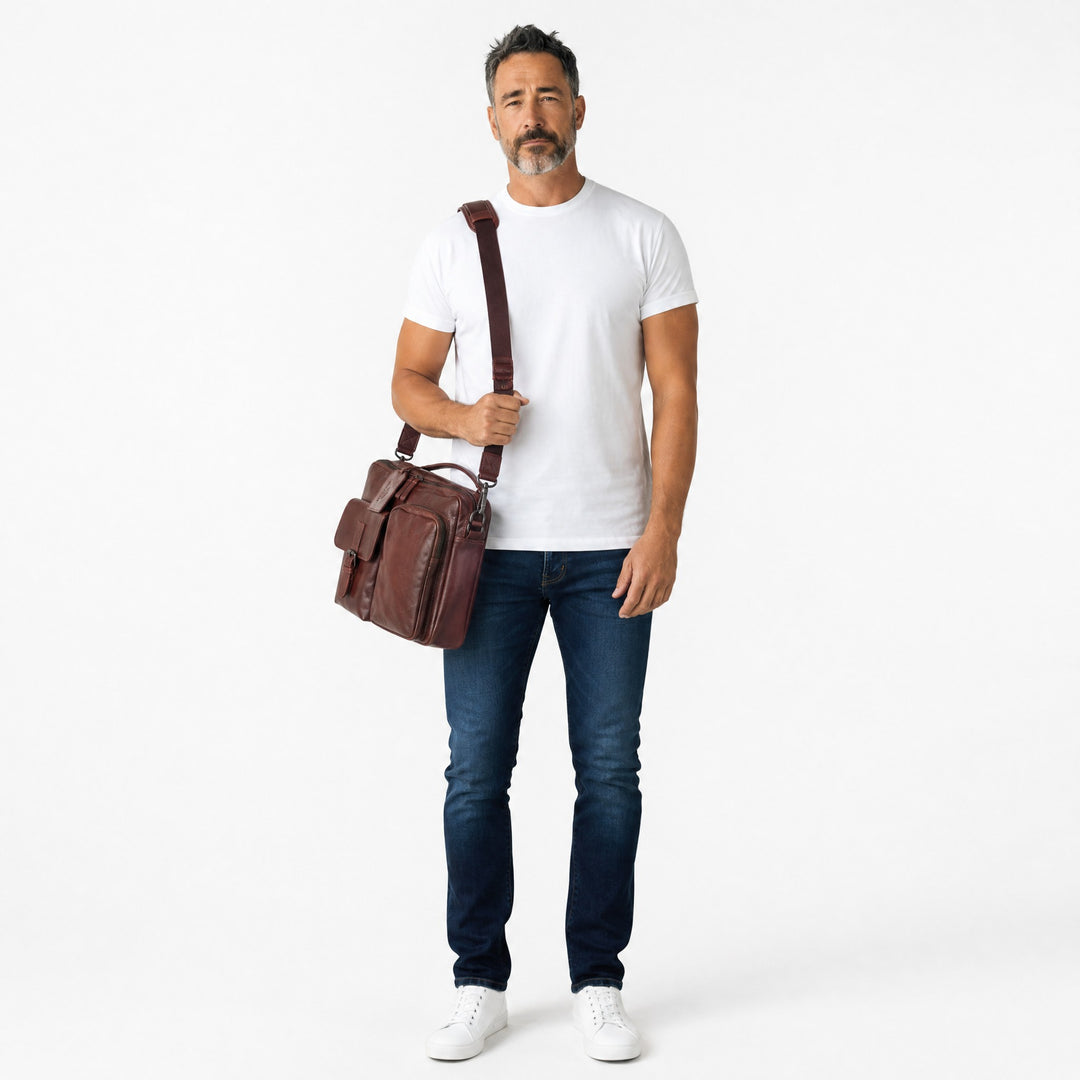 Chris Louis genuine leather briefcase messenger bag in chestnut brown with buckle flap pocket and zippered pocket.