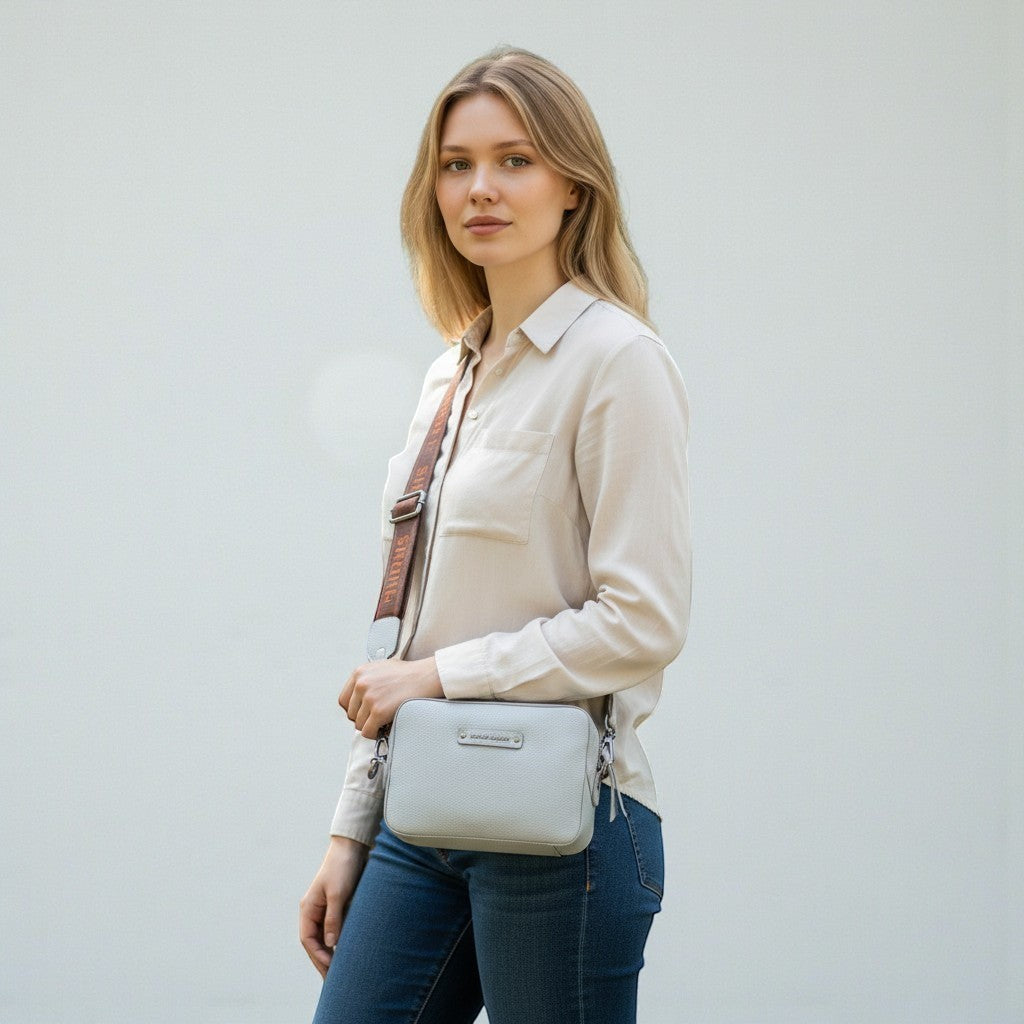 Chris Louis Moolicious grey full grain leather sling bag with webbed strap, adjustable and detachable.