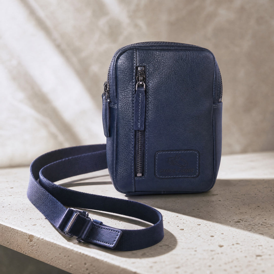 Chris Louis navy blue genuine leather cross-body travel bag with adjustable strap and front zipper pocket.