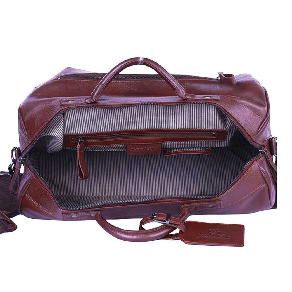 Chris Louis Ohrid Duffle Bag in brown genuine veg-tan hide leather with top handles and detachable strap.