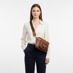Chris Louis Olyia unisex pouch/bum bag in brown and tan full grain leather with multiple zipper compartments.
