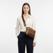 Chris Louis Olyia unisex pouch/bum bag in brown and tan full grain leather with multiple zipper compartments.