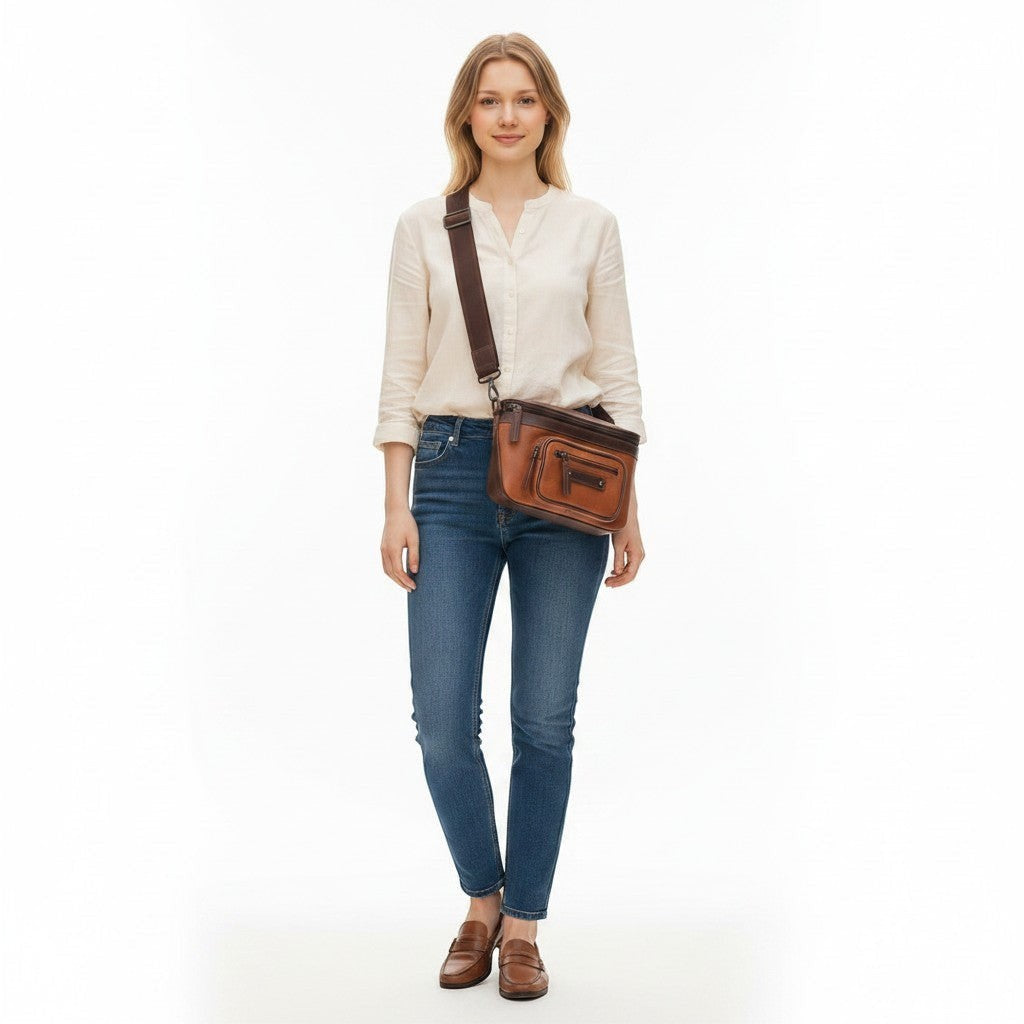 Chris Louis Olyia tan/brown full grain leather unisex pouch bag with multiple zipper compartments.