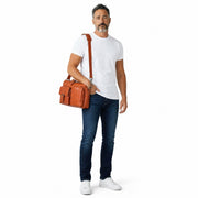 Chris Louis orange genuine leather briefcase with multiple compartments, buckle flap pocket, and zippered pouch.