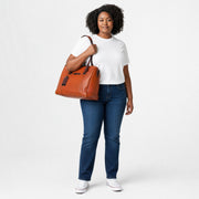 Chris Louis Large Satchel Bag in vibrant orange genuine leather with brown accents and detachable strap.
