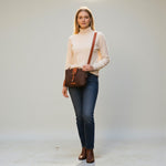 Chris Louis Santorini Leather Cross Body bag in brown with tan strap, front flap and magnet closure.