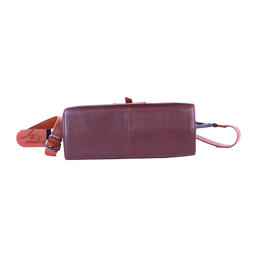 Chris Louis Santorini Leather Cross Body bag in brown with tan strap and metal hardware. Features a front flap and detachable strap.