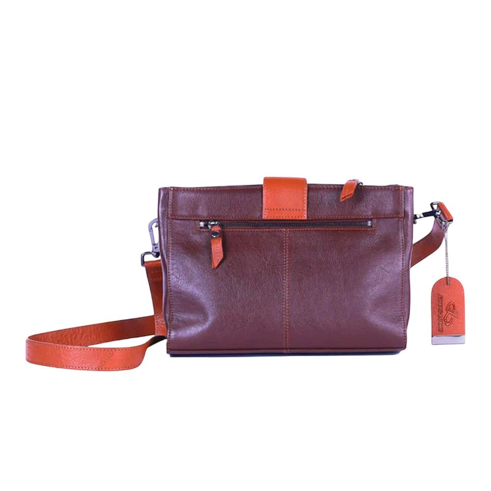 Chris Louis Santorini Leather Cross Body bag in brown with tan flap and strap. Features zip pockets and a detachable strap.