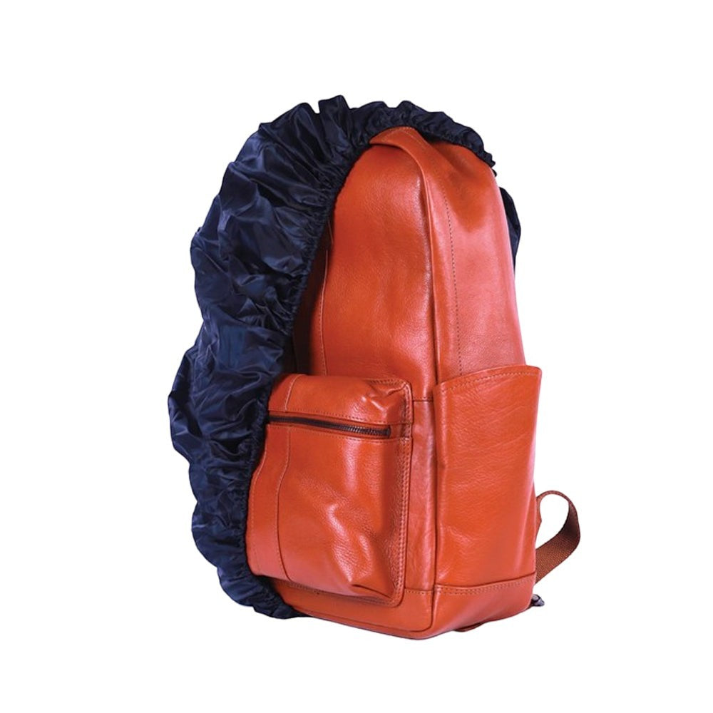 Chris Louis tan genuine leather backpack with front zipper pocket and side pockets, covered by a navy rain cover.