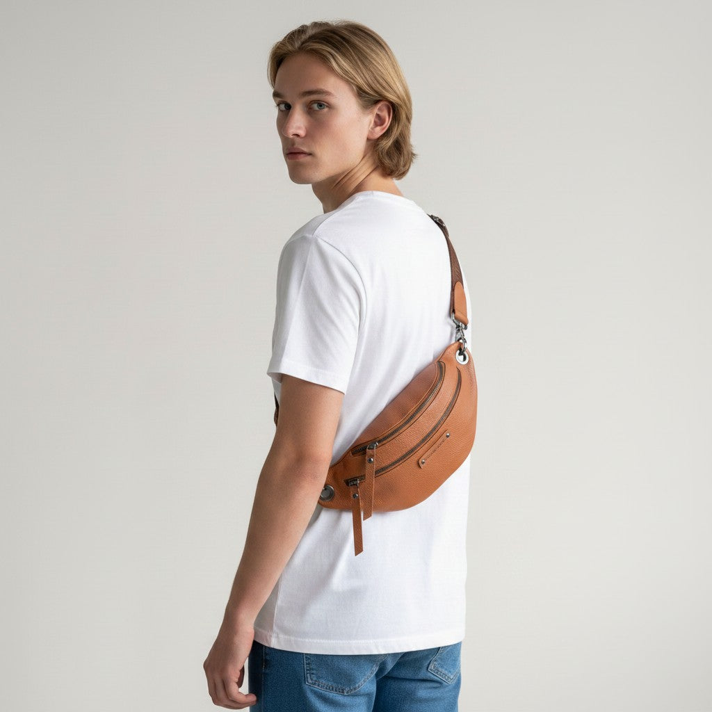 Chris Louis tan leather unisex bum bag with multiple zipper compartments and adjustable strap, worn across the body.